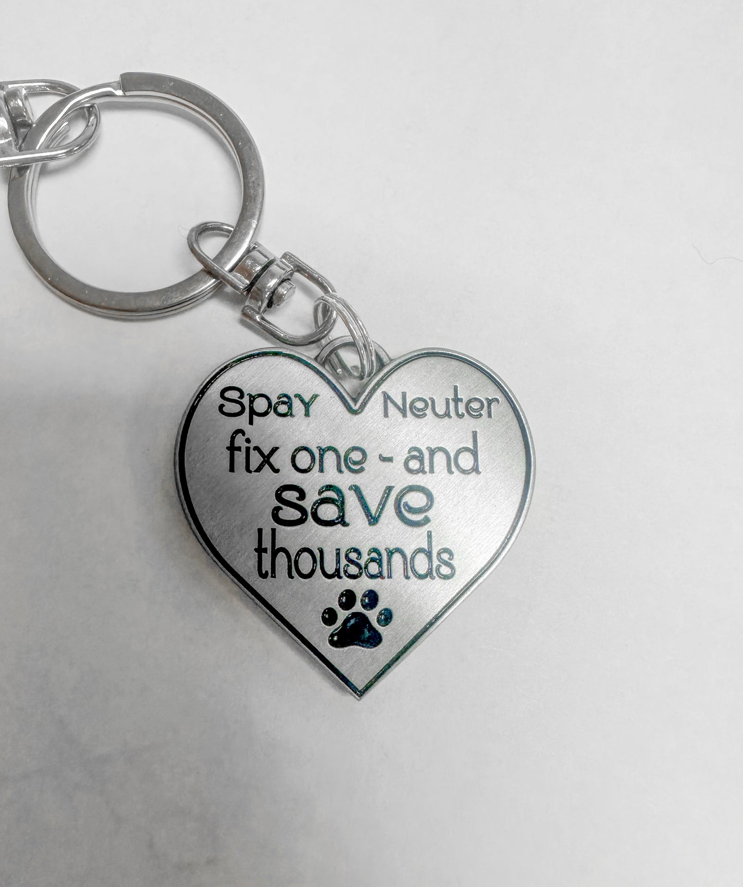 Fix one - save thousands - Furry Fix - metal - keychain, zipper pull or any use.  Very unique - custom designed.